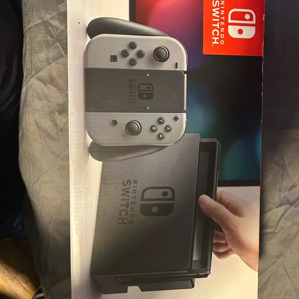 Nintendo Switch with gray Dock, Blue Kirby Case and Sonic Controller Accents,